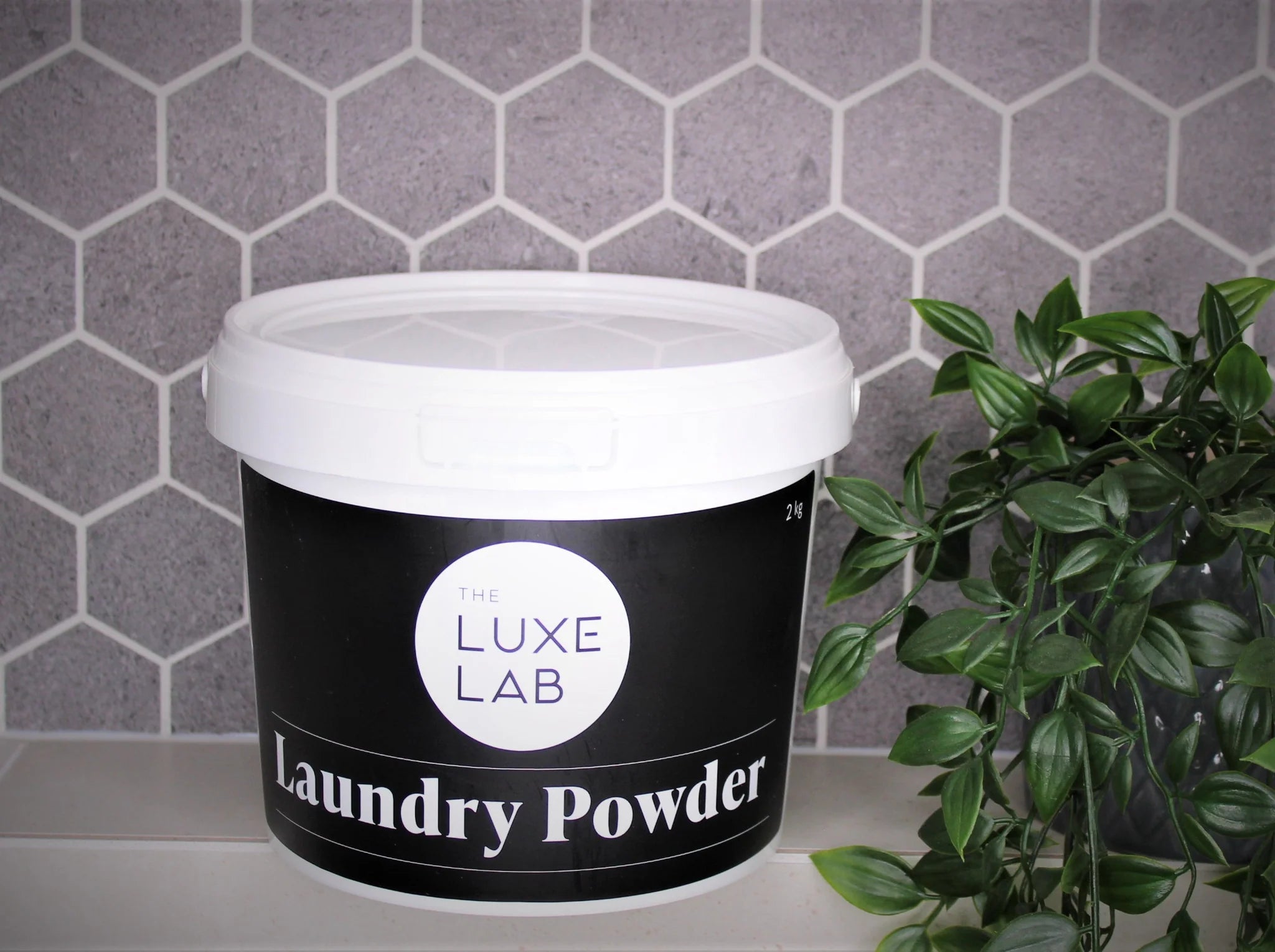 TheLuxeLabLaundryPoweder2kg-withgreenery_1024x1024_2x_6f1003c9-eda1-4b63-a4a6-1ea5daba4490.webp